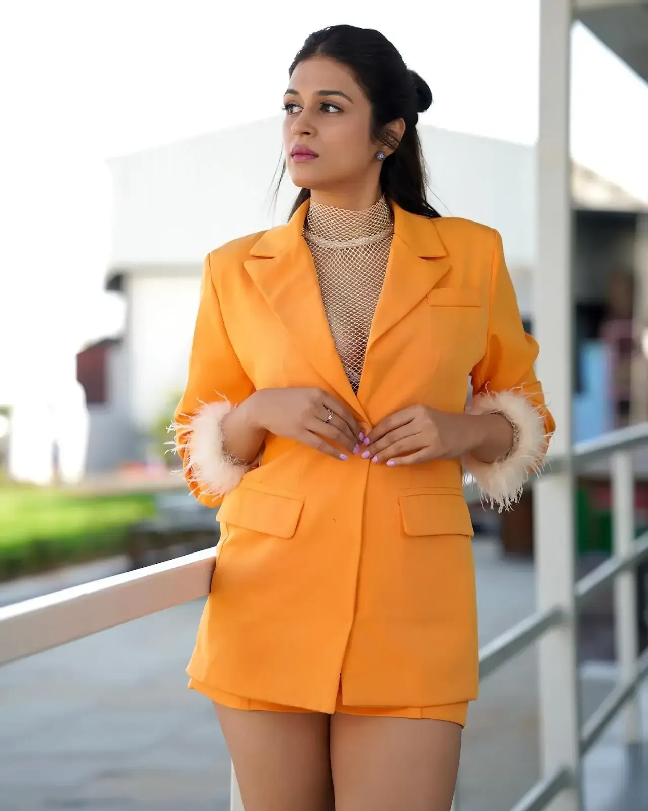 Actress Shraddha Das Long Legs Show in Mini Orange Top